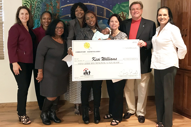 On behalf of Chris Evert Charities, officials from the Ounce of Prevention Fund of Florida present the Vitas Gerulaitis Memorial Scholarship to Tallahassee’s Kesi Williams.